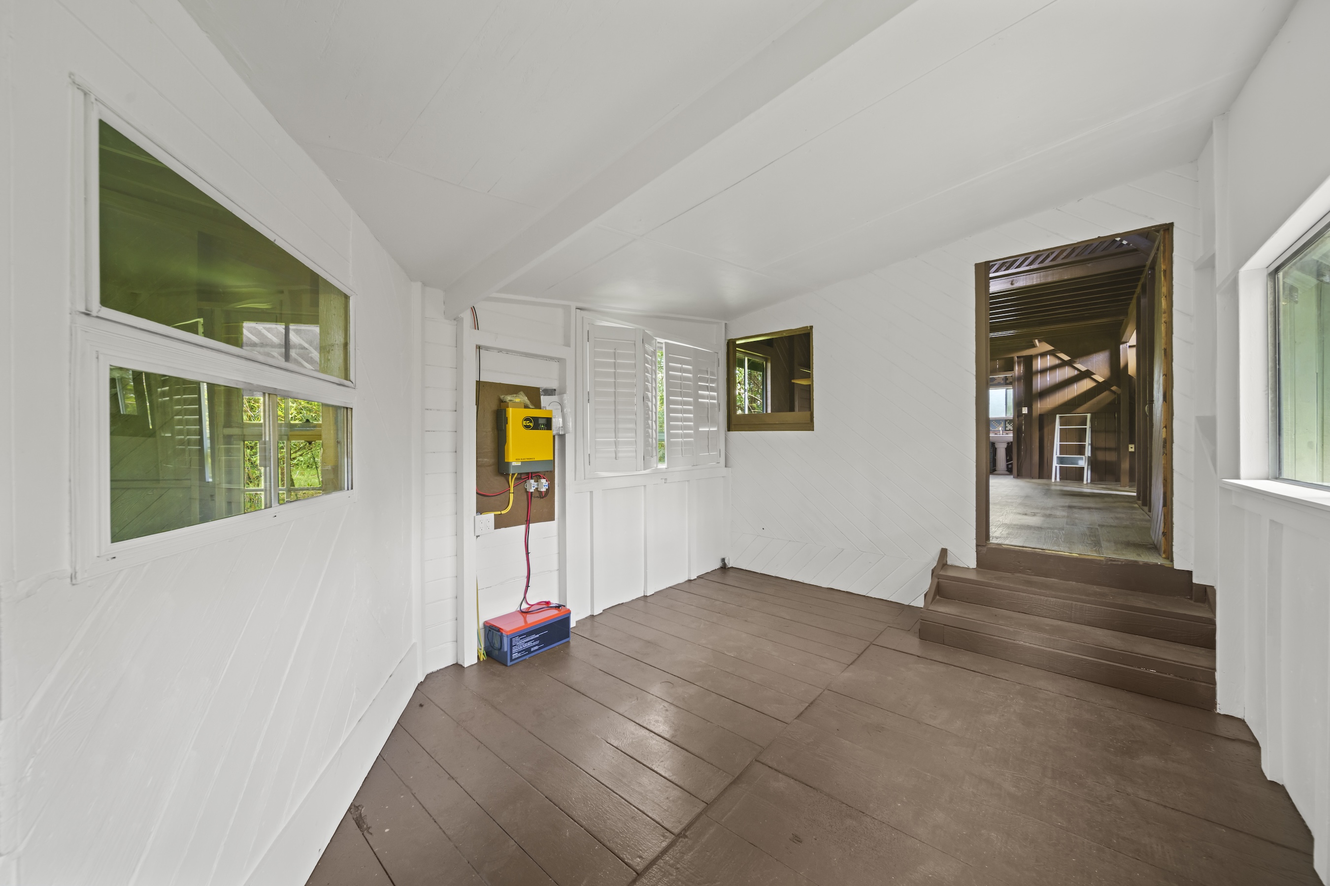 16-1857 Hopue Road Mountain View, HI 96771 - Photo 18 of 30 a view of an entryway with wooden floor and windows
