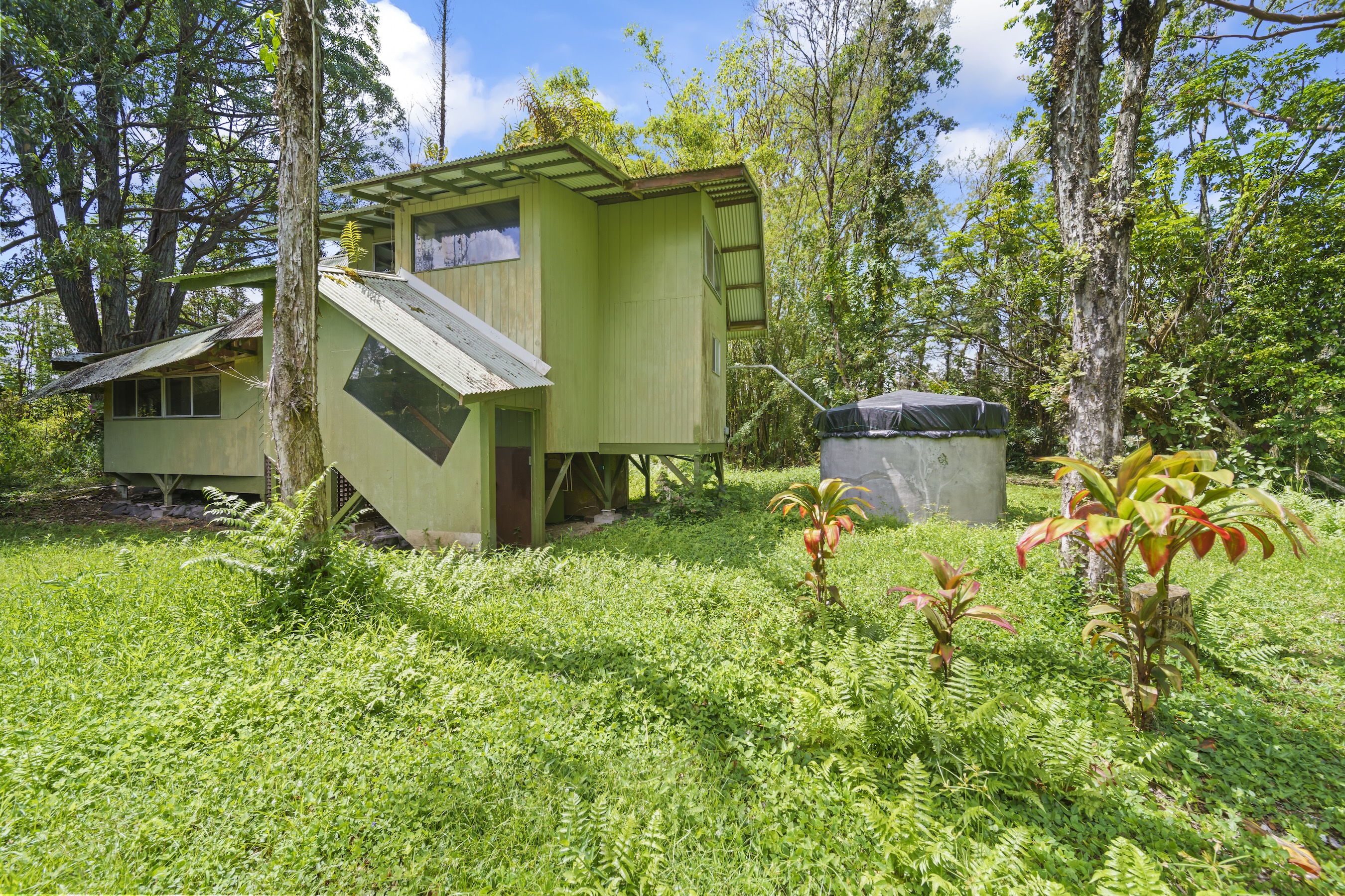 16-1857 Hopue Road Mountain View, HI 96771 - Photo 7 of 30 a house view with a garden space