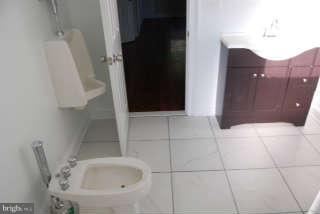 2904 Allendale Road Baltimore, MD 21216 - Photo 19 of 30 a bathroom with a sink and toilet