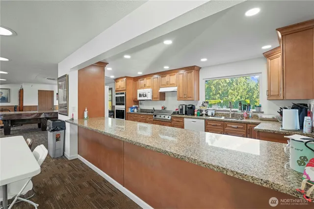 a view of a house with backyard and porch