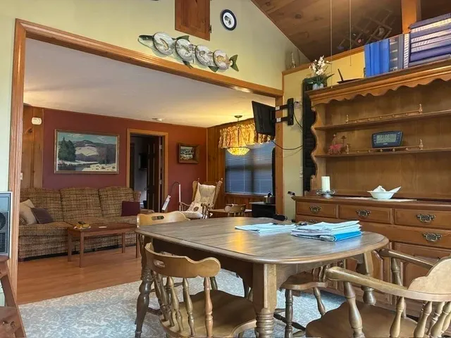 a view of a room with furniture and a window