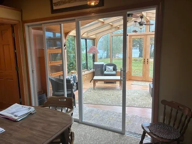 a bed sitting in a bedroom next to a window