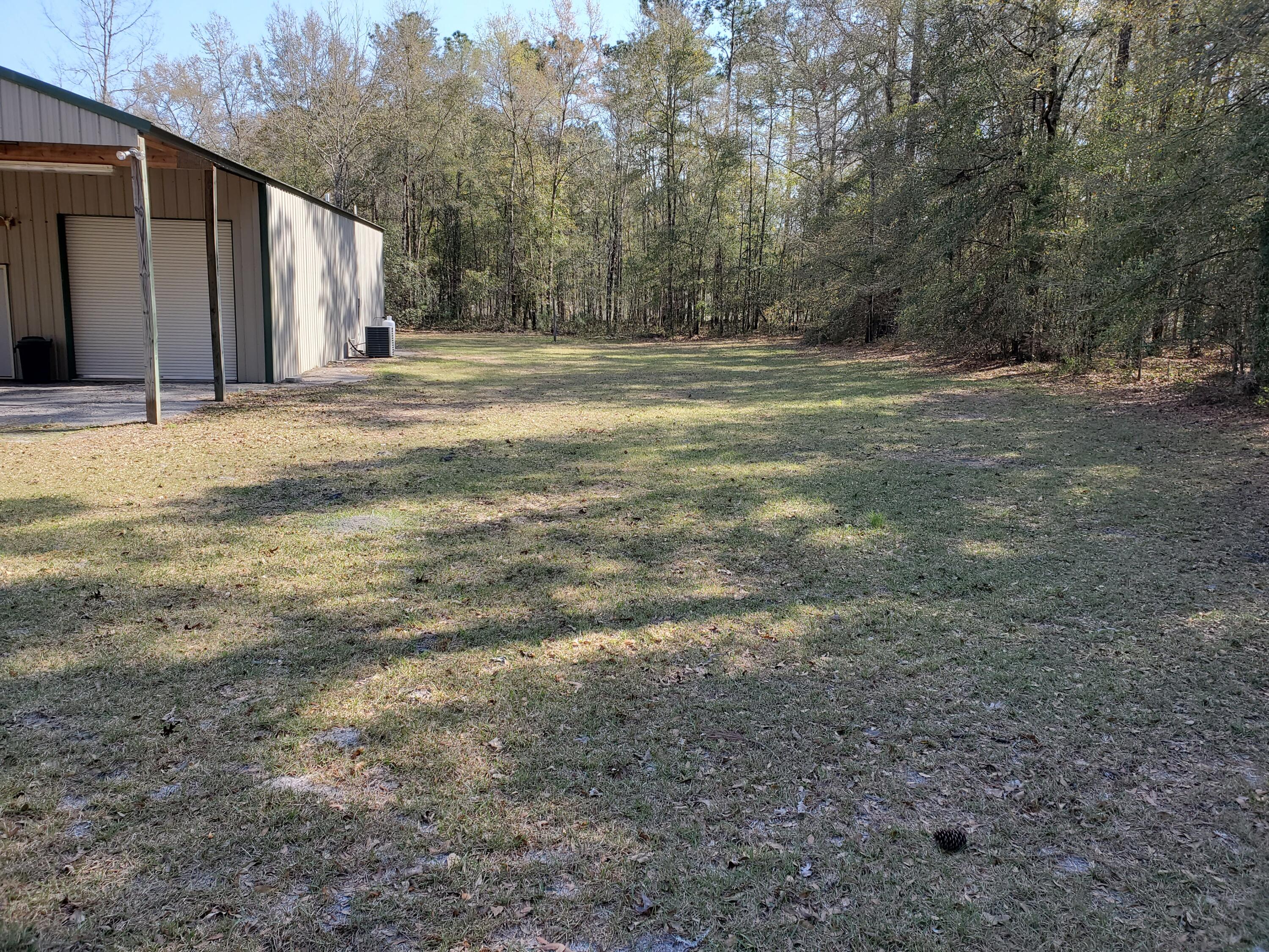 354 Old Cemetery Road Jamestown, SC 29453 - Photo 25 of 25 Side Yard Cleared and Wooded