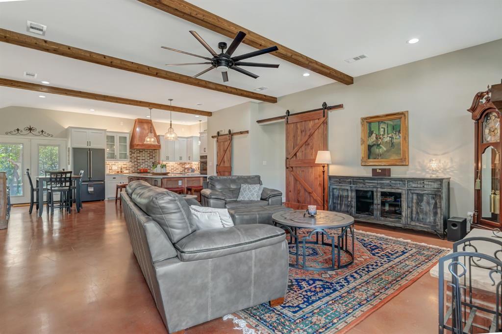 129 Whiskey Rnch Road Runaway Bay, TX 76426 - Photo 5 of 39 a living room with furniture and a fireplace