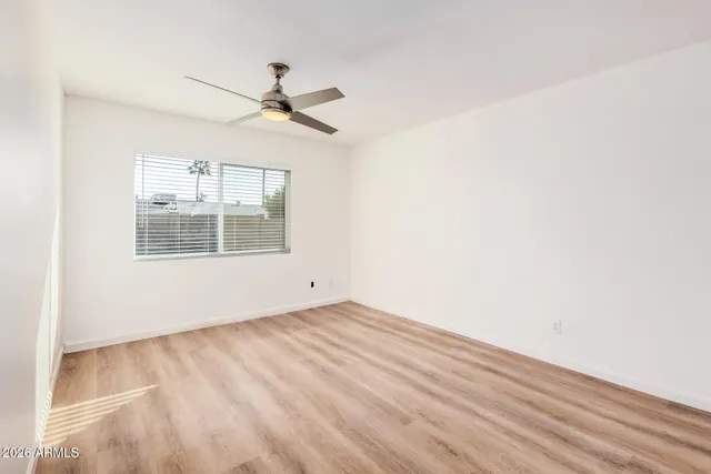 a kitchen with stainless steel appliances granite countertop a refrigerator a stove a sink and a microwave