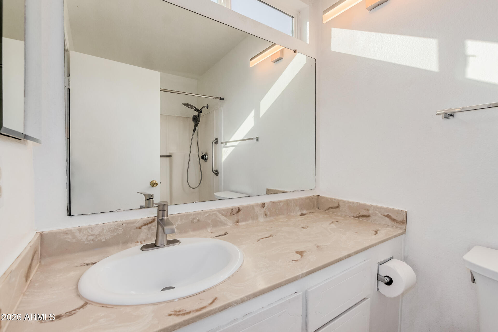 11009 South Tewa Street Phoenix, AZ 85044 - Photo 13 of 26 a bathroom with a granite countertop sink and a mirror