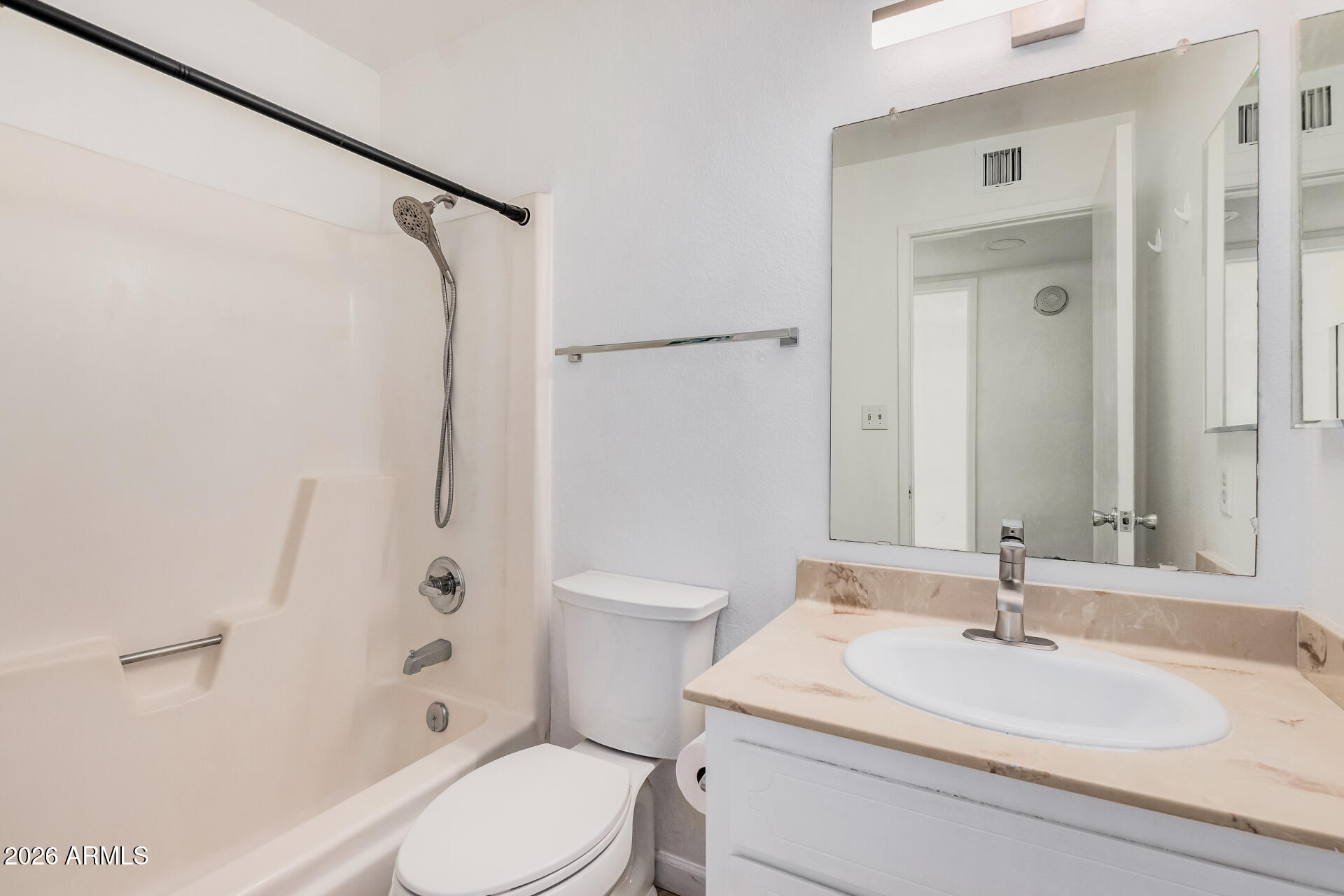 11009 South Tewa Street Phoenix, AZ 85044 - Photo 19 of 26 a bathroom with a sink a toilet and shower