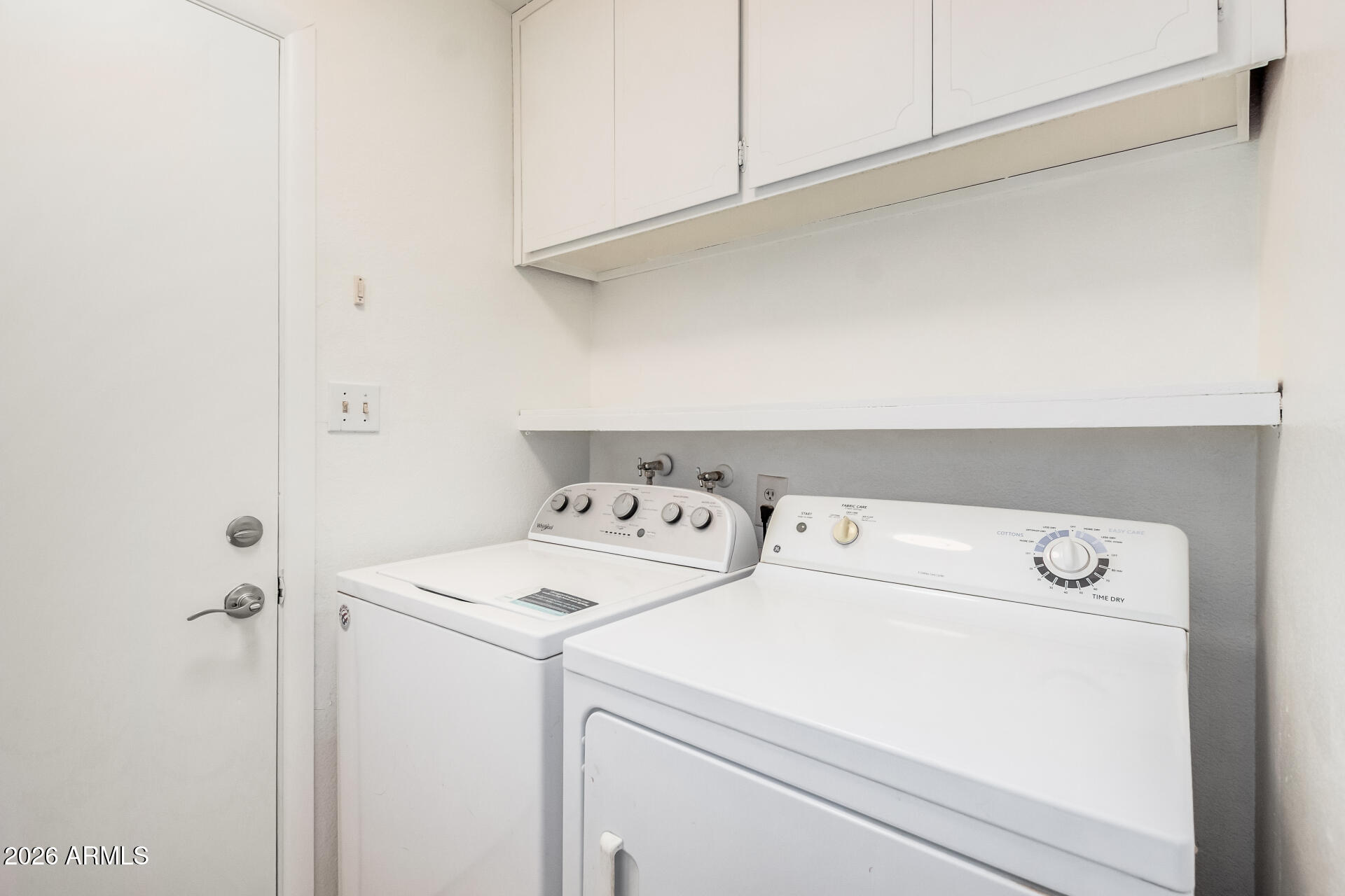 11009 South Tewa Street Phoenix, AZ 85044 - Photo 20 of 26 a utility room with dryer and washer