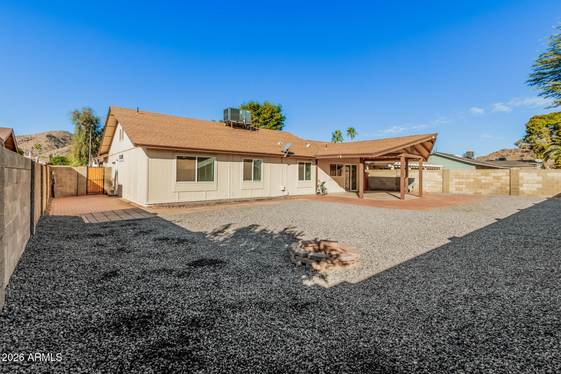 11009 South Tewa Street Phoenix, AZ 85044 - Photo 23 of 26 a view of a house with a backyard