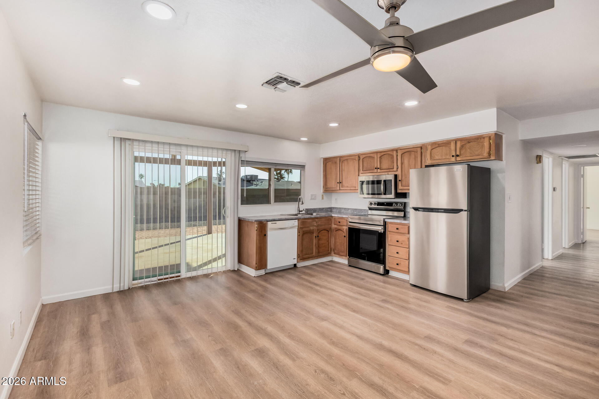 11009 South Tewa Street Phoenix, AZ 85044 - Photo 6 of 26 a view of kitchen with stainless steel appliances refrigerator oven and stove