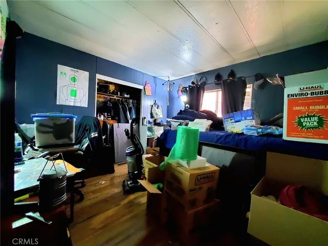 a bed sitting in a bedroom next to a window