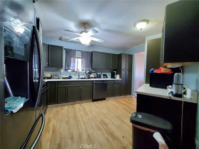 a gym room with gym equipment and wooden floor