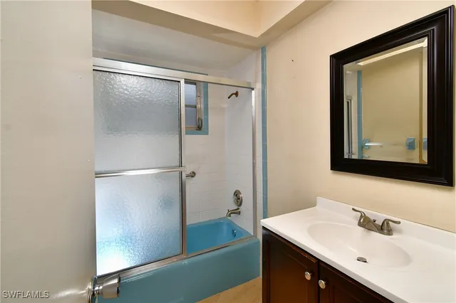 a view of a hallway view with wooden floor and staircase