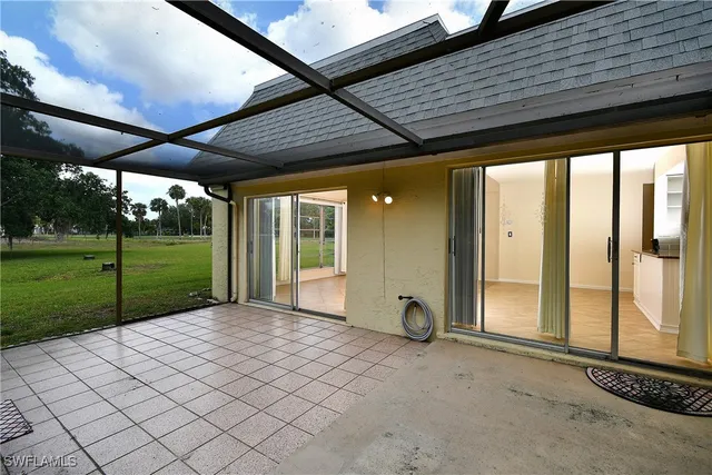 an aerial view of a house with a yard table and chairs