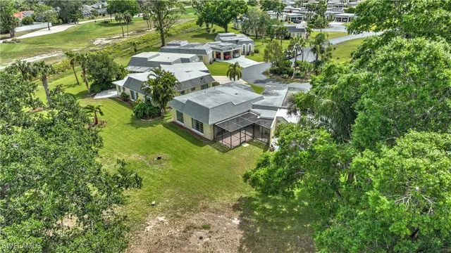 a view of yard with swimming pool and trees in the background