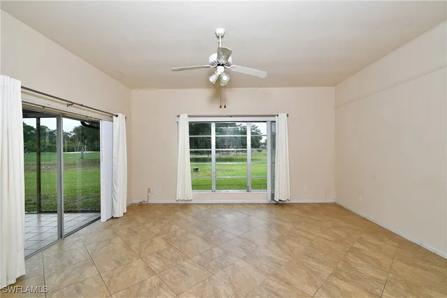 a view of a kitchen with a sink and a refrigerator