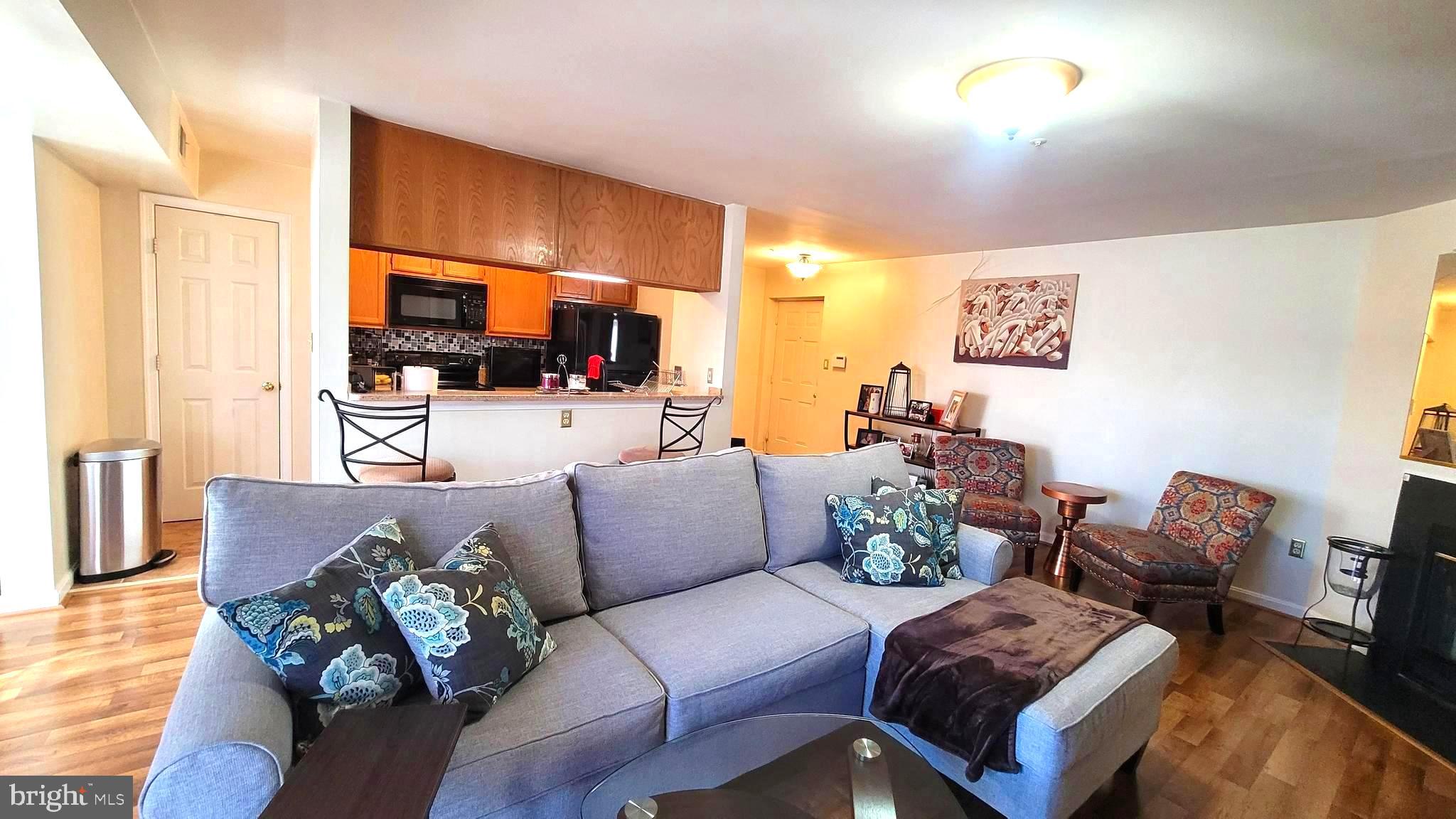 a living room with furniture fireplace and a flat screen tv