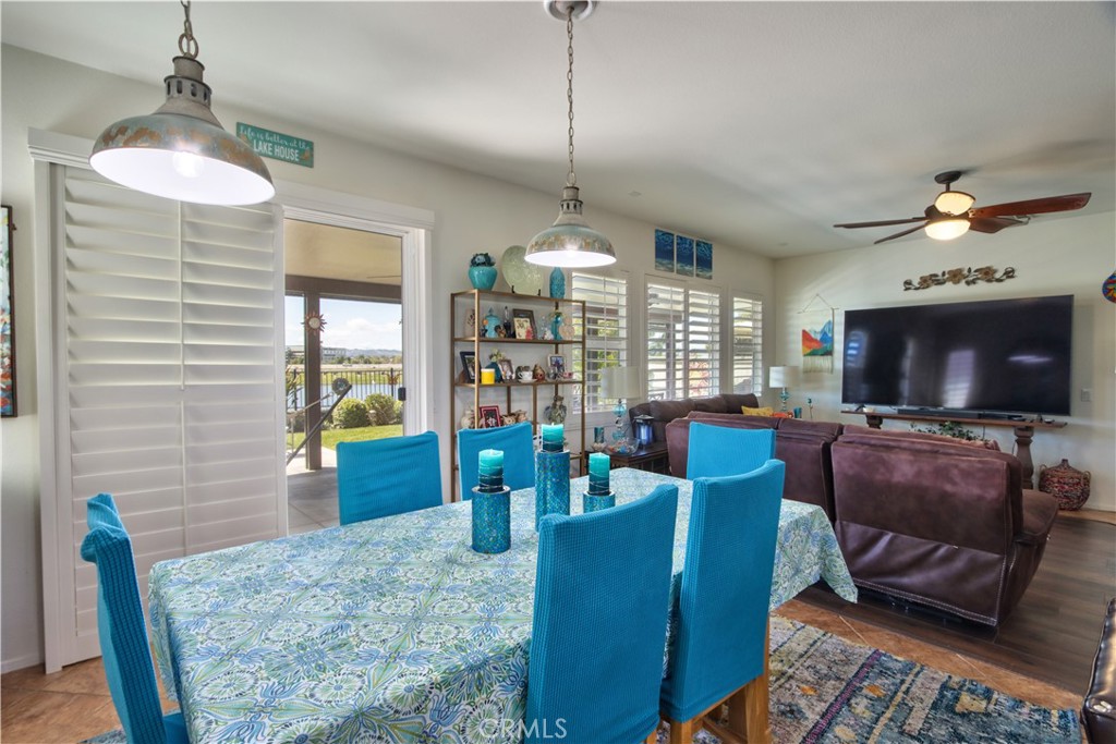 27929 Crystal Spring Drive Menifee, CA 92584 - Photo 12 of 50 a living room with furniture and a flat screen tv