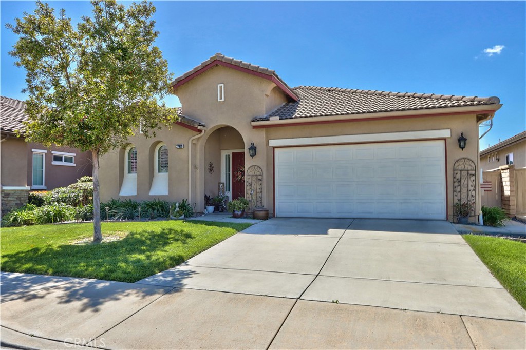 27929 Crystal Spring Drive Menifee, CA 92584 - Photo 2 of 50 a front view of a house with garden