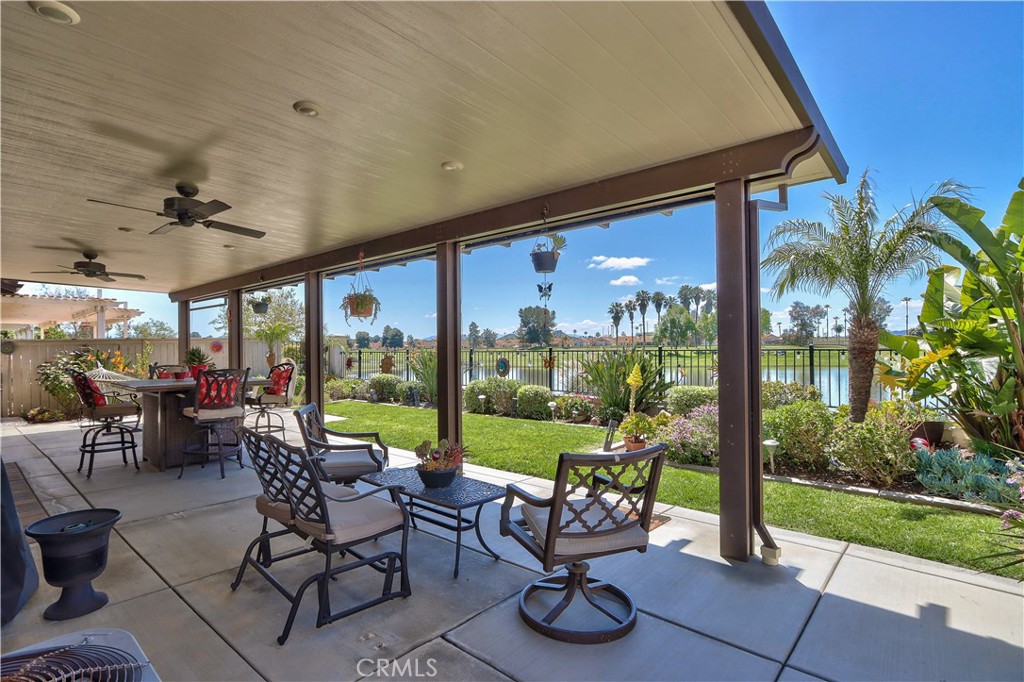 27929 Crystal Spring Drive Menifee, CA 92584 - Photo 33 of 50 a view of an chairs and table in patio with a garden