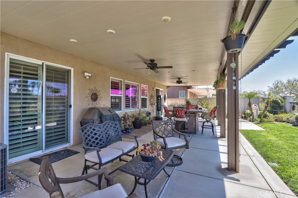 27929 Crystal Spring Drive Menifee, CA 92584 - Photo 36 of 50 a outdoor living space with patio furniture and garden view