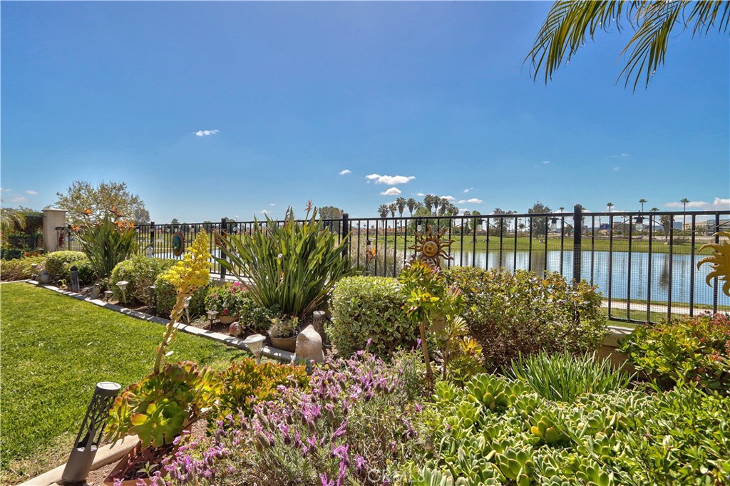 27929 Crystal Spring Drive Menifee, CA 92584 - Photo 37 of 50 a view of a garden with plants and a bench