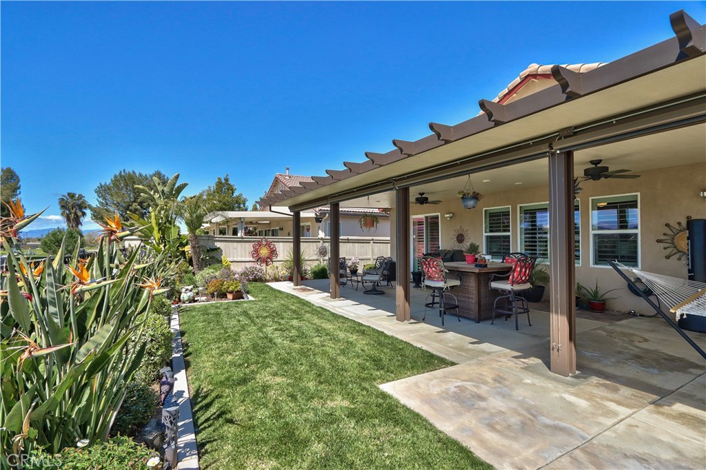27929 Crystal Spring Drive Menifee, CA 92584 - Photo 40 of 50 a view of a house with backyard porch and sitting area