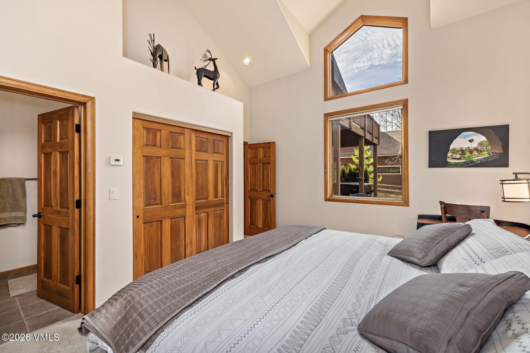 91 Creamery Trail Edwards, CO 81632 - Photo 23 of 44 a bedroom with a bed and a large mirror on the dresser