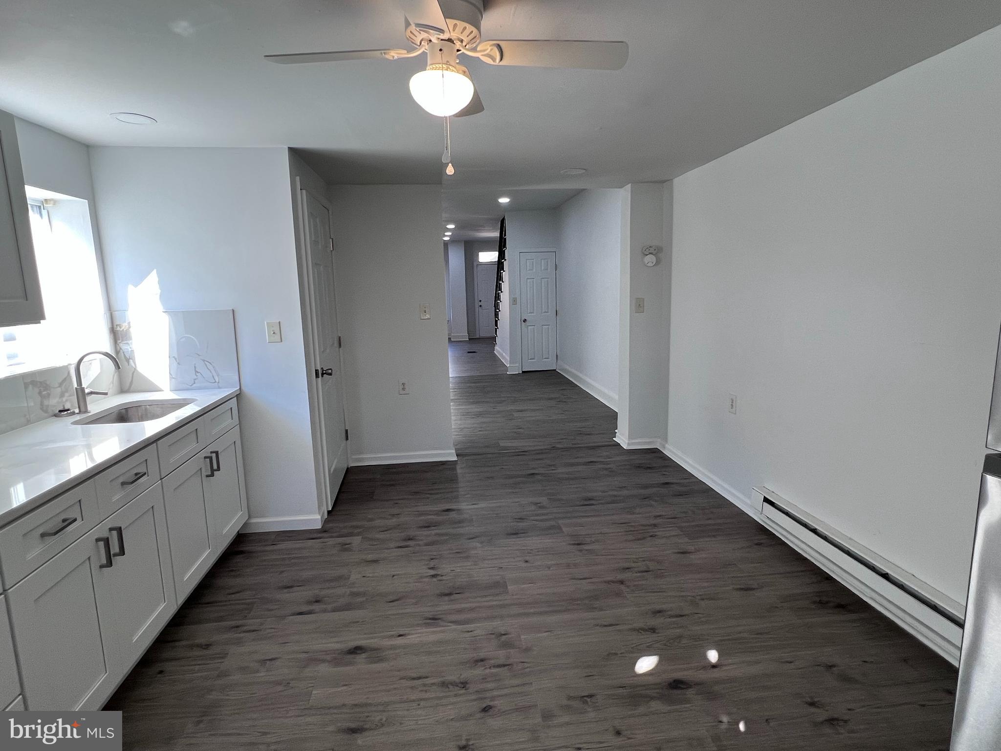 2117 West 4th Street Chester, PA 19013 - Photo 11 of 35 a view of a bathroom with sink and mirror