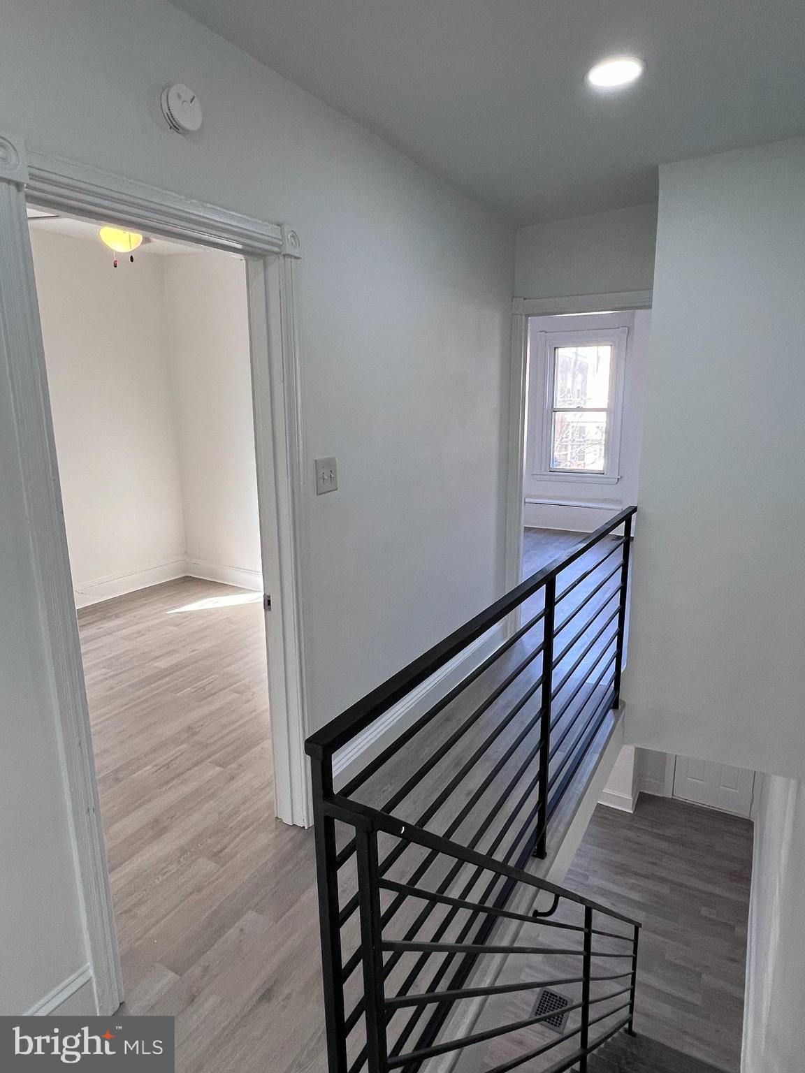 2117 West 4th Street Chester, PA 19013 - Photo 14 of 35 a view of a hallway with wooden floor and stairs