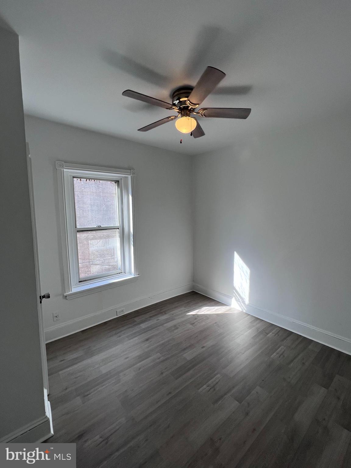 2117 West 4th Street Chester, PA 19013 - Photo 17 of 35 wooden floor in an empty room with a window