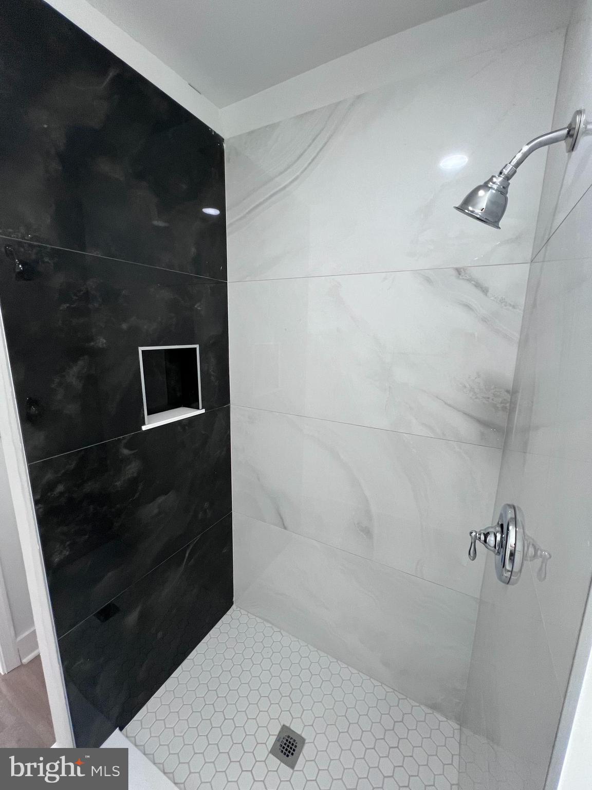 2117 West 4th Street Chester, PA 19013 - Photo 24 of 35 a bathroom with a shower