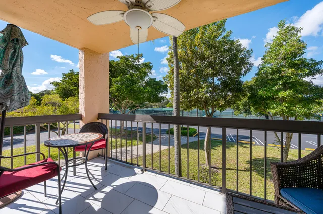 a view of a chairs and table in patio
