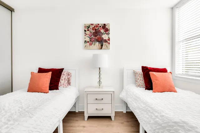 a bedroom with a bed and a dresser