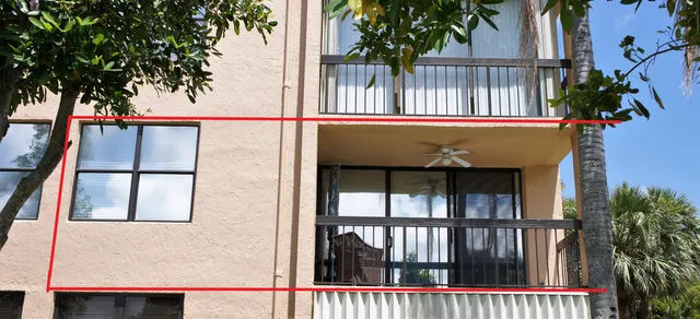 a view of a water fountain and a building in the background