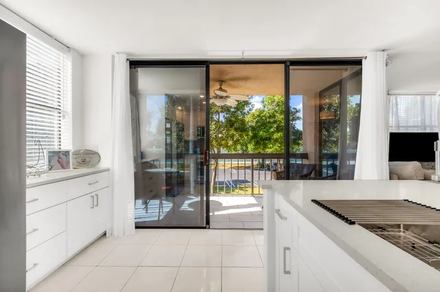 a large kitchen with a large window