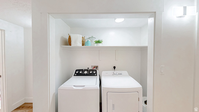 368 East 700 North Springville, UT 84663 - Photo 27 of 55 Laundry area with washing machine and dryer and light wood-style flooring
