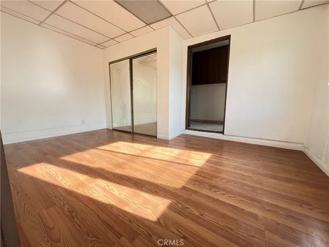 a view of kitchen with furniture and electronic appliances