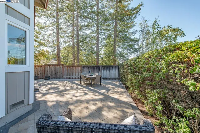 a view of a backyard with sitting area