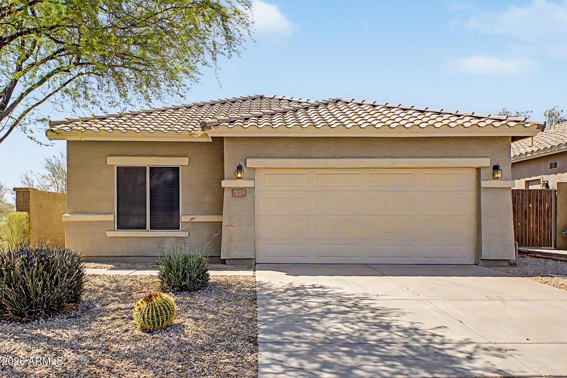 40602 North Apollo Way Anthem, AZ 85086 - Photo 1 of 38 a front view of a house