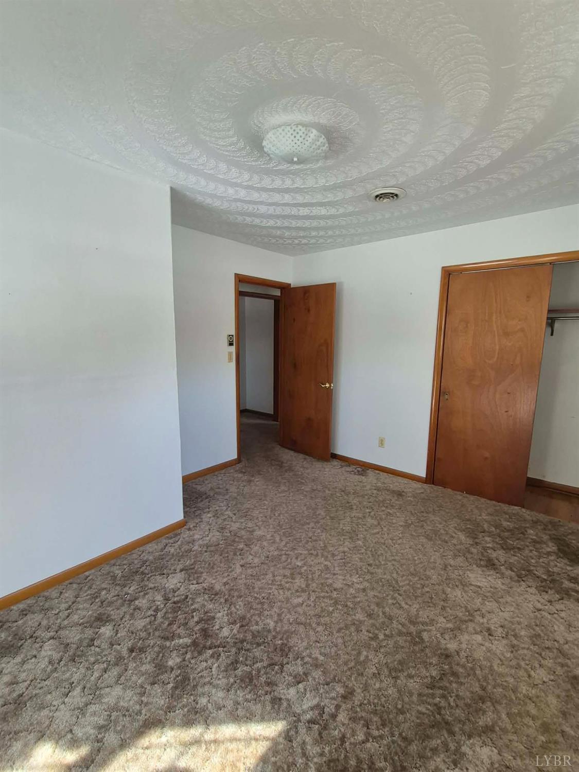 123 Elmwood Lane Rustburg, VA 24588 - Photo 11 of 25 a view of an empty room and window