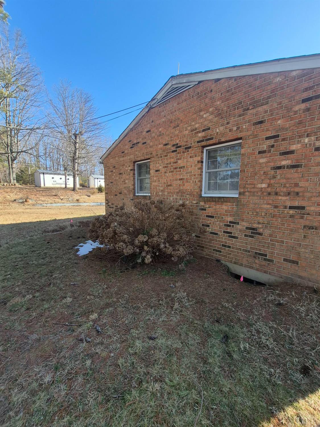123 Elmwood Lane Rustburg, VA 24588 - Photo 19 of 25 a view of a backyard with large trees