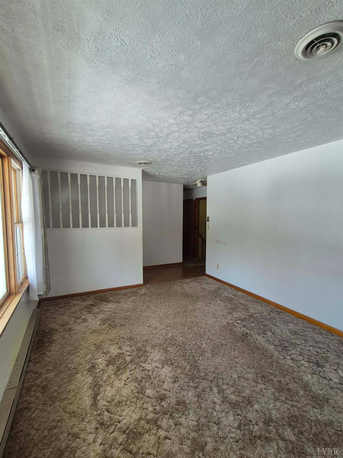 123 Elmwood Lane Rustburg, VA 24588 - Photo 8 of 25 an empty room with windows