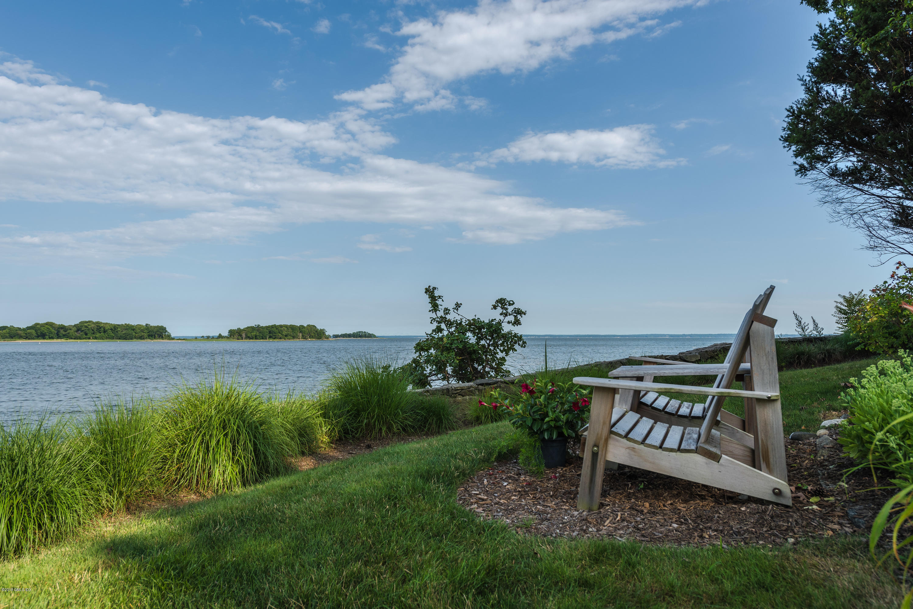 147 Byram Shore Road Greenwich, CT 06830 - Photo 18 of 19 a view of a garden with lawn chairs