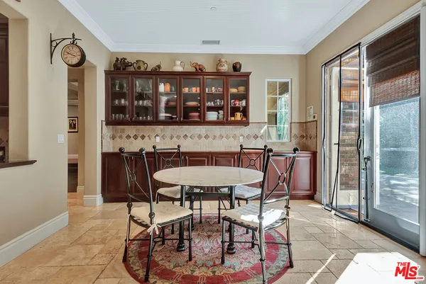 a view of a dining room with furniture and window