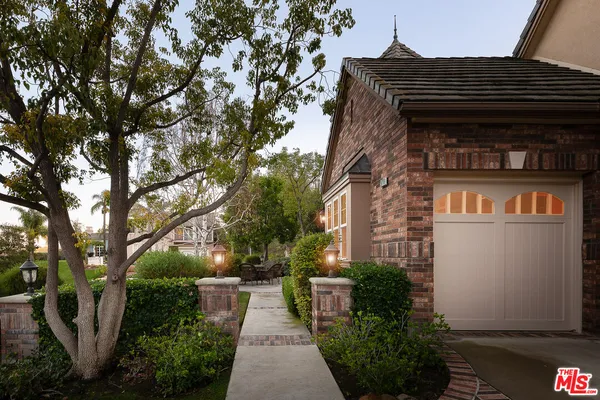 a view of a house with a tree
