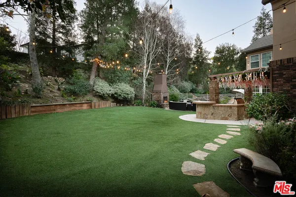 a backyard of a house with lots of green space
