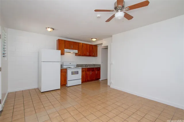 a kitchen with stainless steel appliances a refrigerator and a stove