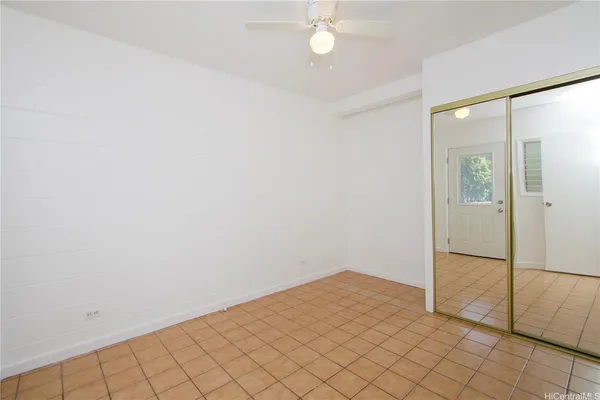 an empty room with fan