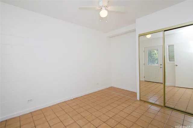 an empty room with fan